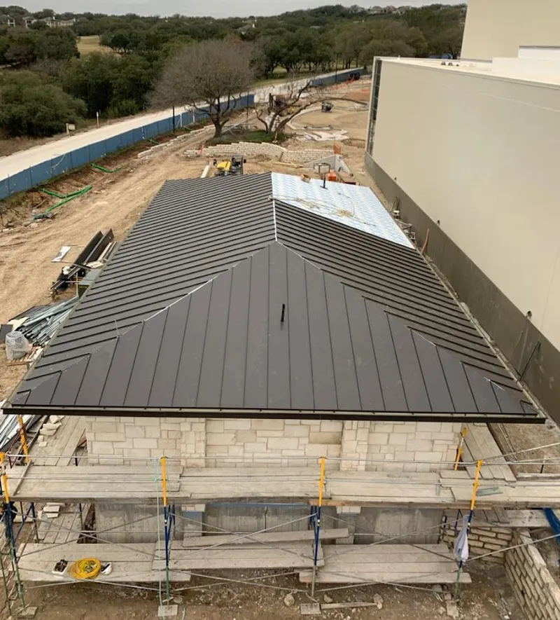 Metal roof new construction with scaffolding in Middlesex